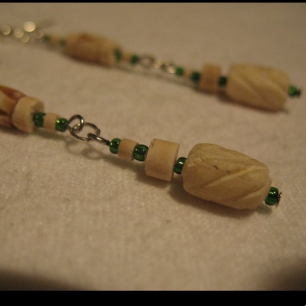 Bone and glass beads earrings.